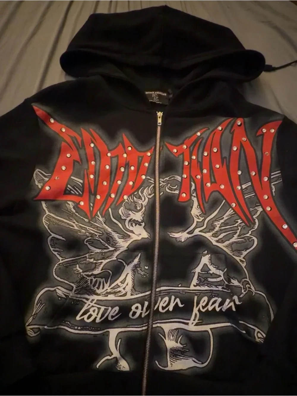 Mixed Emotions Black Zip-Up Hoodie with Red Studded Graphic